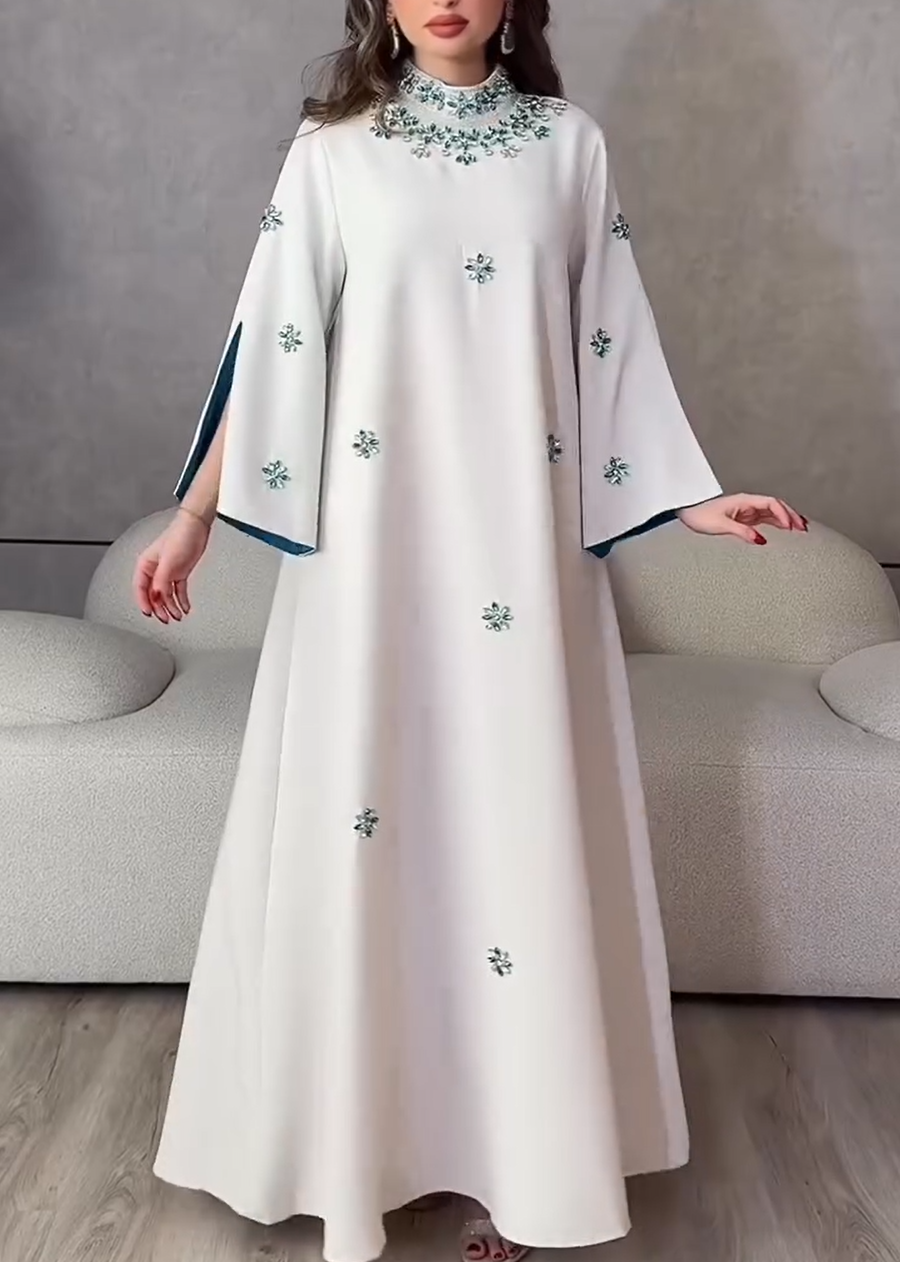 Luxurious evening dress with turquoise crystal embroidery