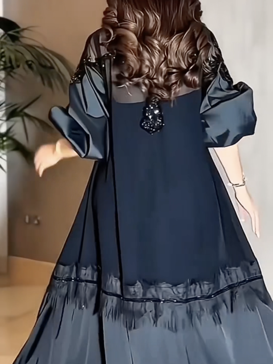 Luxurious black evening dress with elegant embroidery and satin sleeves