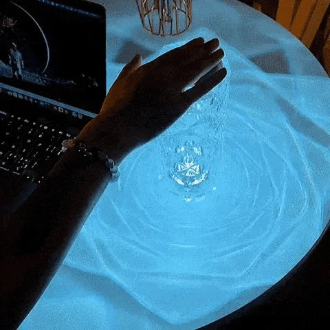 Crystal lamp casting soft blue light across a tabletop