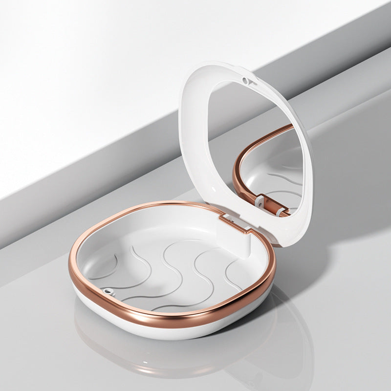 White hinged storage case with interior mirror and rose-gold-tone trim