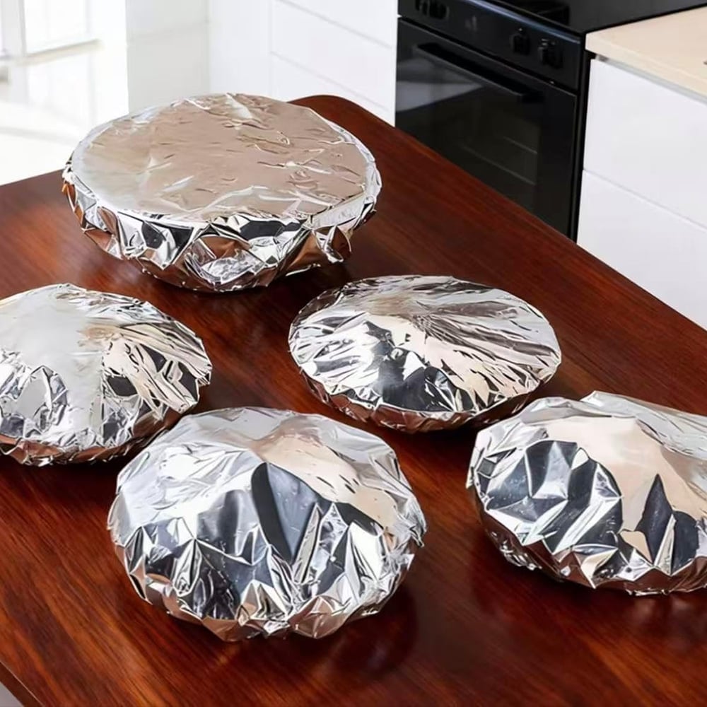 Aluminum foil heat retaining covers placed over serving bowls