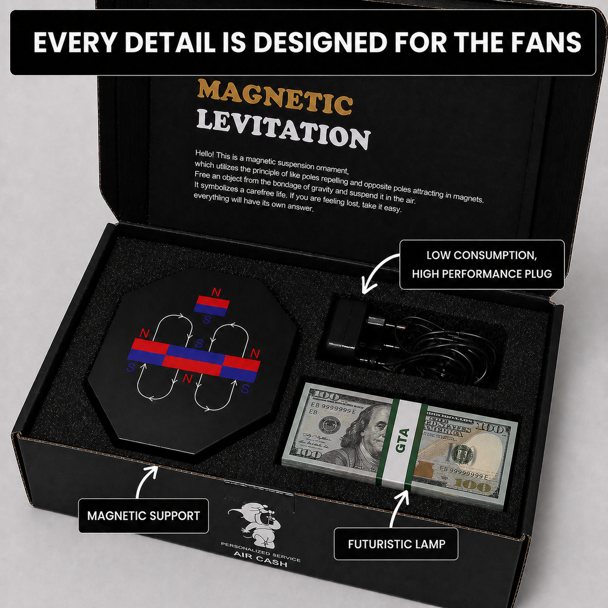 Open presentation box showing the levitating cash display, magnetic base and power adapter