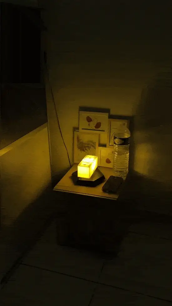 Animated view of the levitating cash lamp glowing in a dark room
