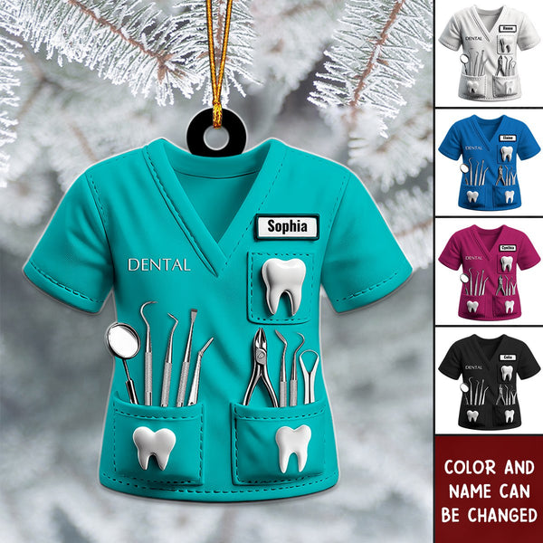 Teal personalized dentist ornament on a Christmas tree with other uniform colors shown
