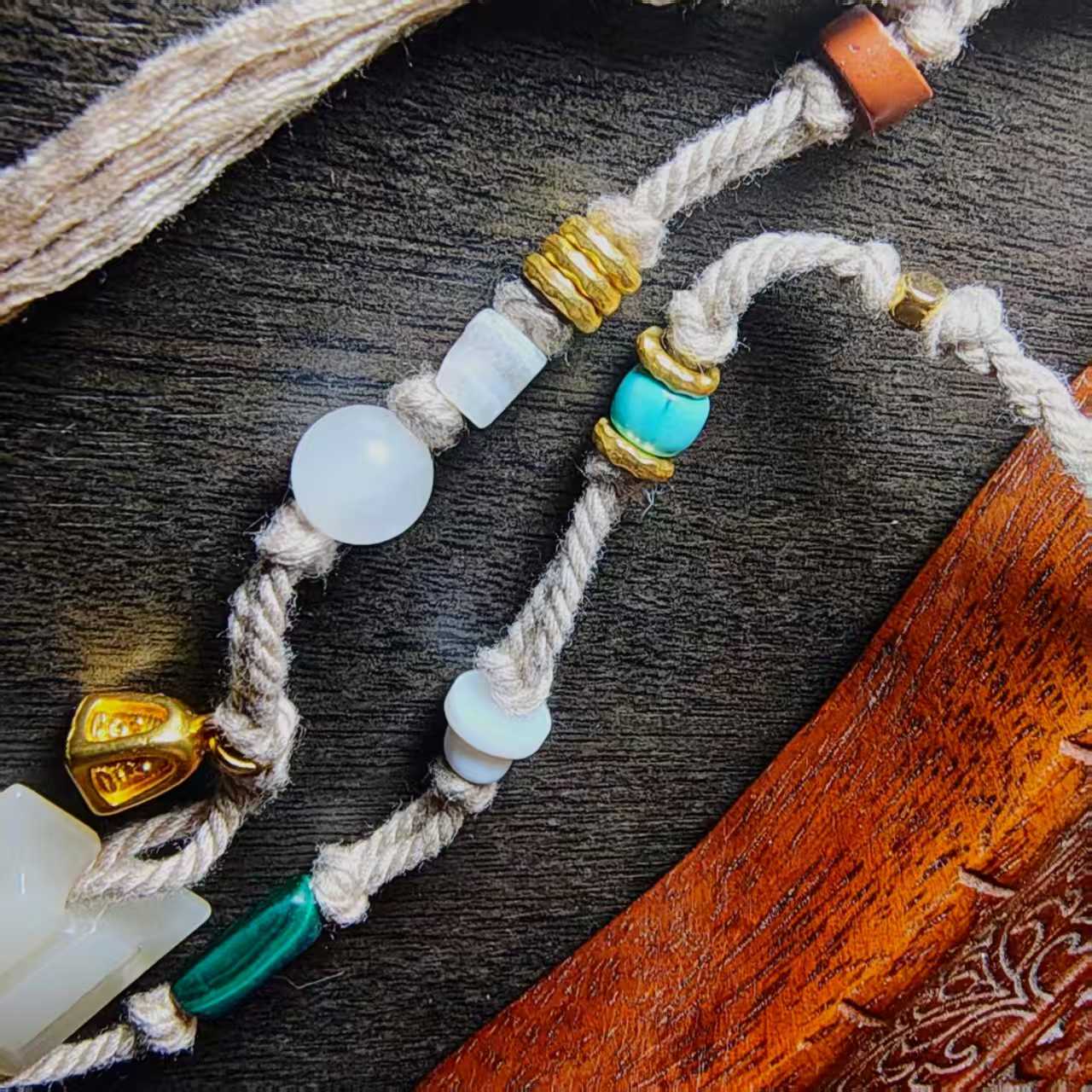 15558和田玉工字佩手工麻绳多宝挂链 Hetian Jade Gong-shaped Pendant Handmade Hemp Rope Multi-gem Hanging Necklace.