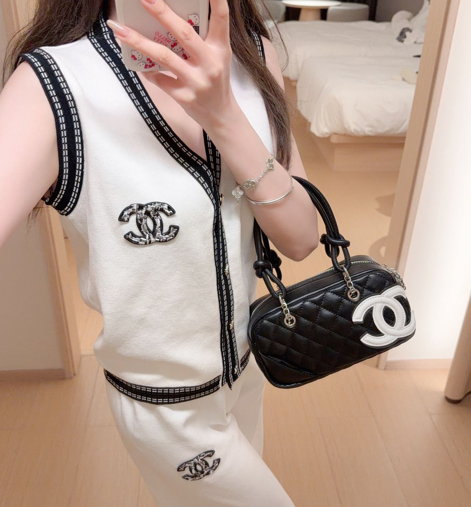 スタイリッシュなニットノースリーブトップスとワイドレッグパンツのツーピースセット