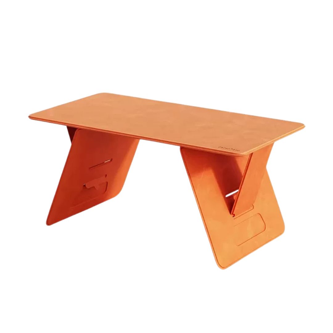 Orange leather folding lap desk on white background, three-quarter product view