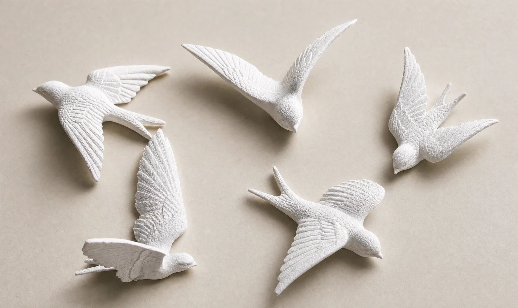 Hand-sculpted resin birds with intricate feather d