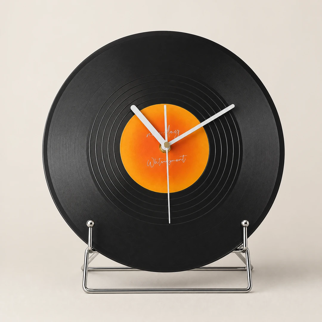 Retro vinyl desktop clock front view on warm gray background