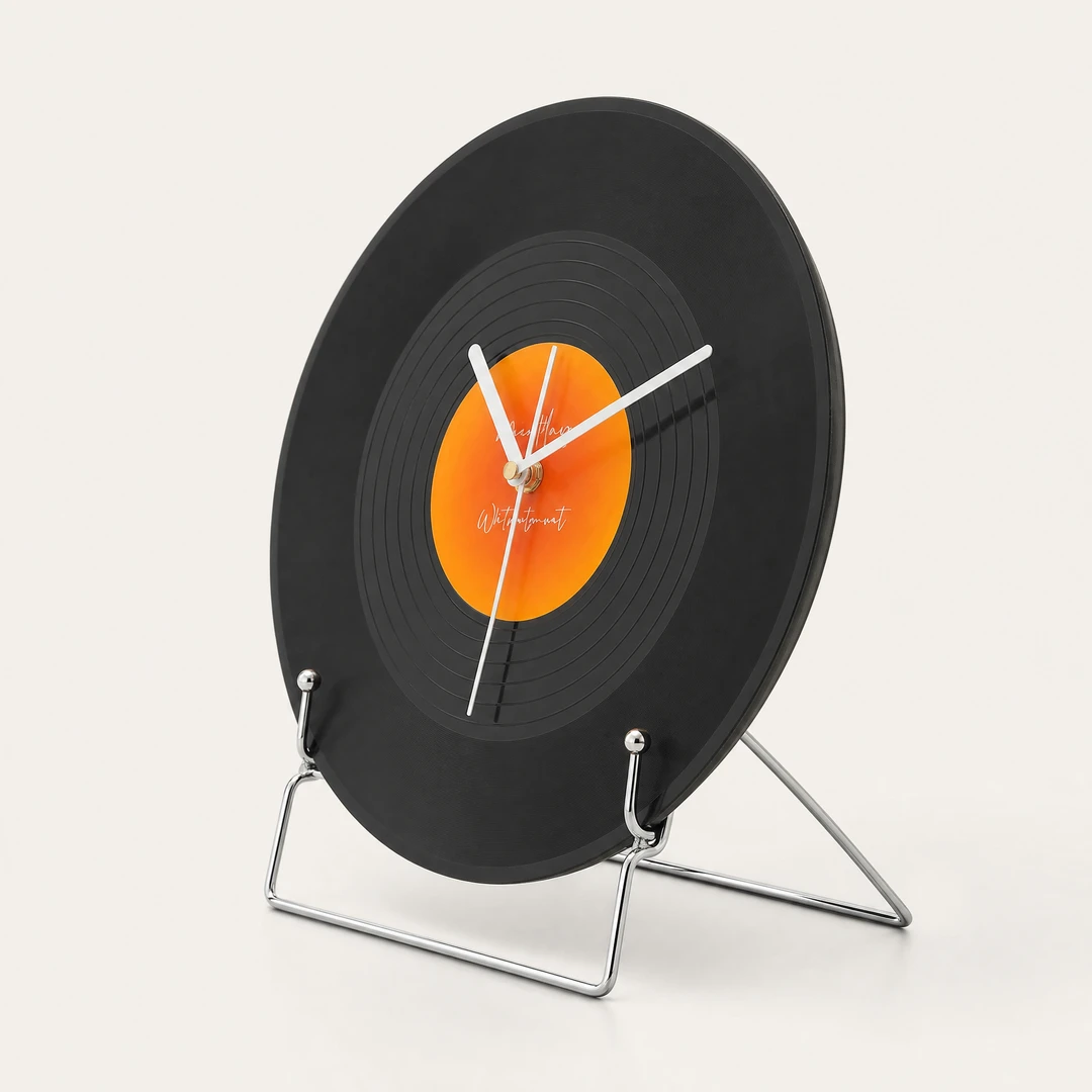 Retro vinyl desktop clock 3/4 angle showing slim profile and chrome stand