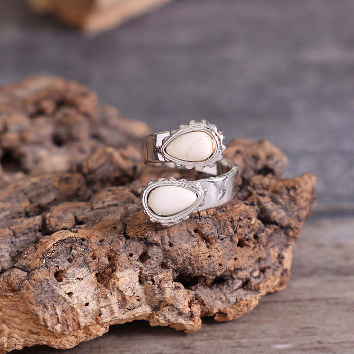 Alternate view of a turquoise-style adjustable cross ring for fit and profile questions