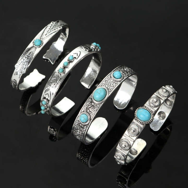 Four-piece turquoise-colored cuff set used for wrist proportion planning