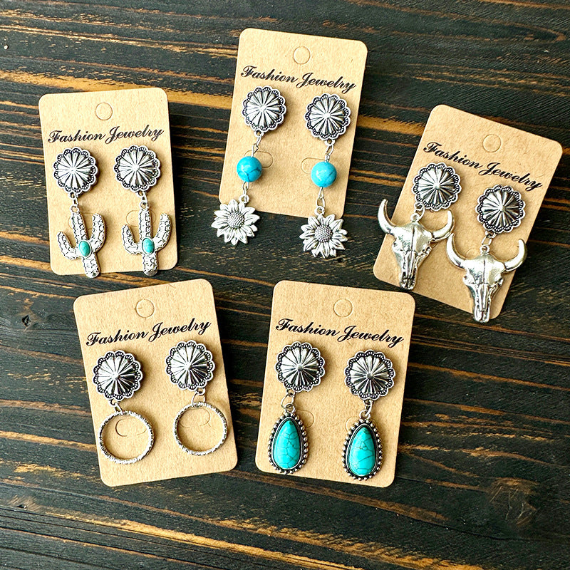 Western Turquoise Floral Cow Skull Cross Earrings - product image 1