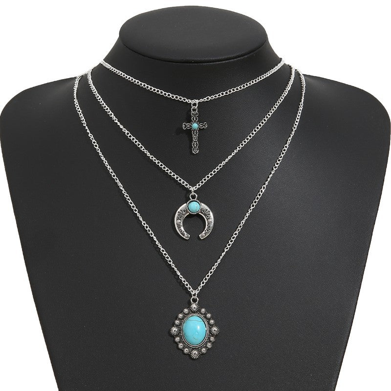 Turquoise Cow Skull Moon Cross Necklace - product image 1