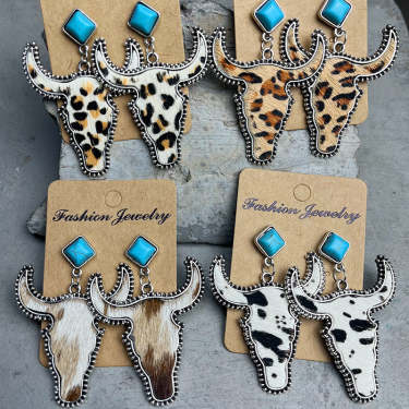 Western Turquoise Boho Vintage Cow Skull Earrings used as a costume turquoise jewelry care example