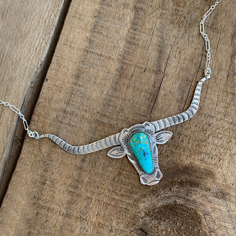 Western Vintage Cow Skull Cross Necklace - product image 1