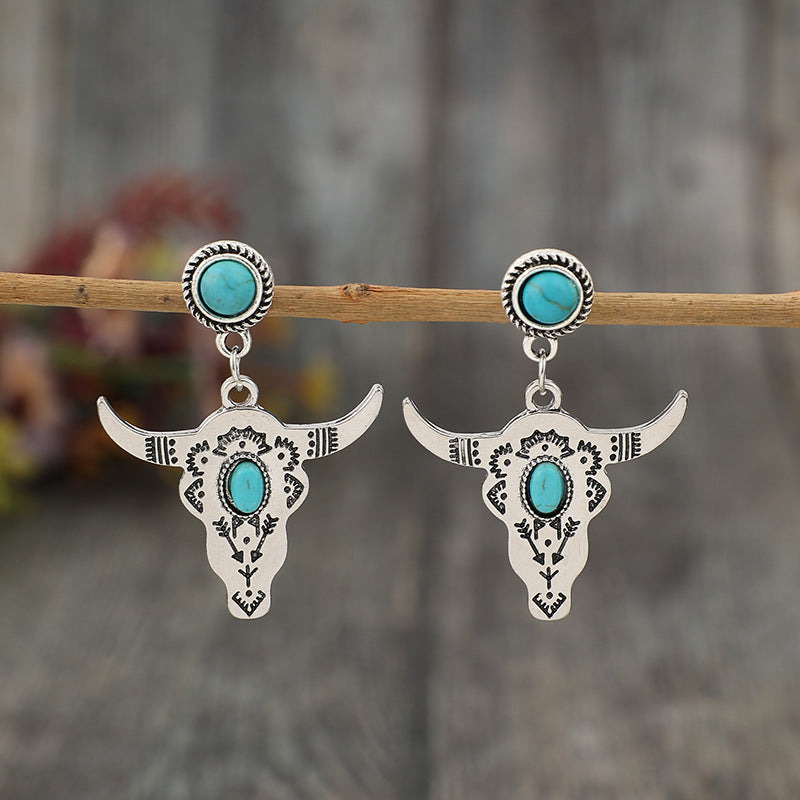 Western Turquoise Vintage Cow Skull Cross Earrings - product image 1