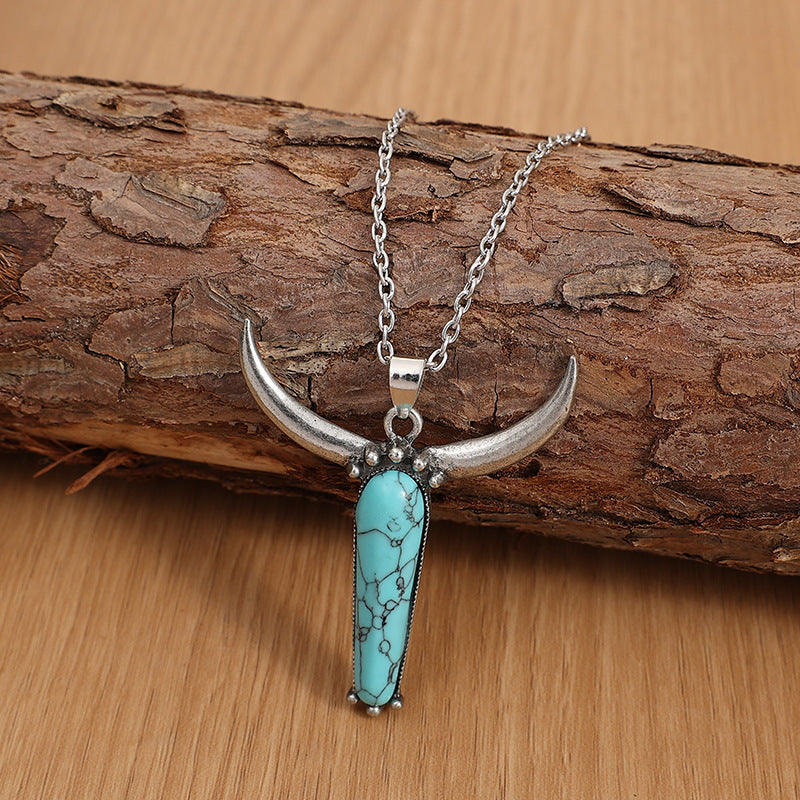 Turquoise Vintage Cow Skull Cross Necklace - product image 1
