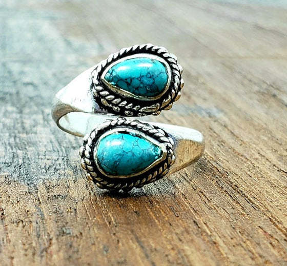 Turquoise vintage cross ring evaluated for adjustable fit and cowgirl-inspired styling
