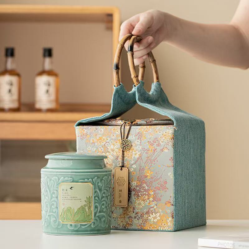 AuienTea Jasmine Tea Gift Set, Embossed Celadon Ceramic Tea Caddy, Vintage Floral Fabric Gift Basket with Bamboo Handle, Scented Tea for Holiday & Business Gifting