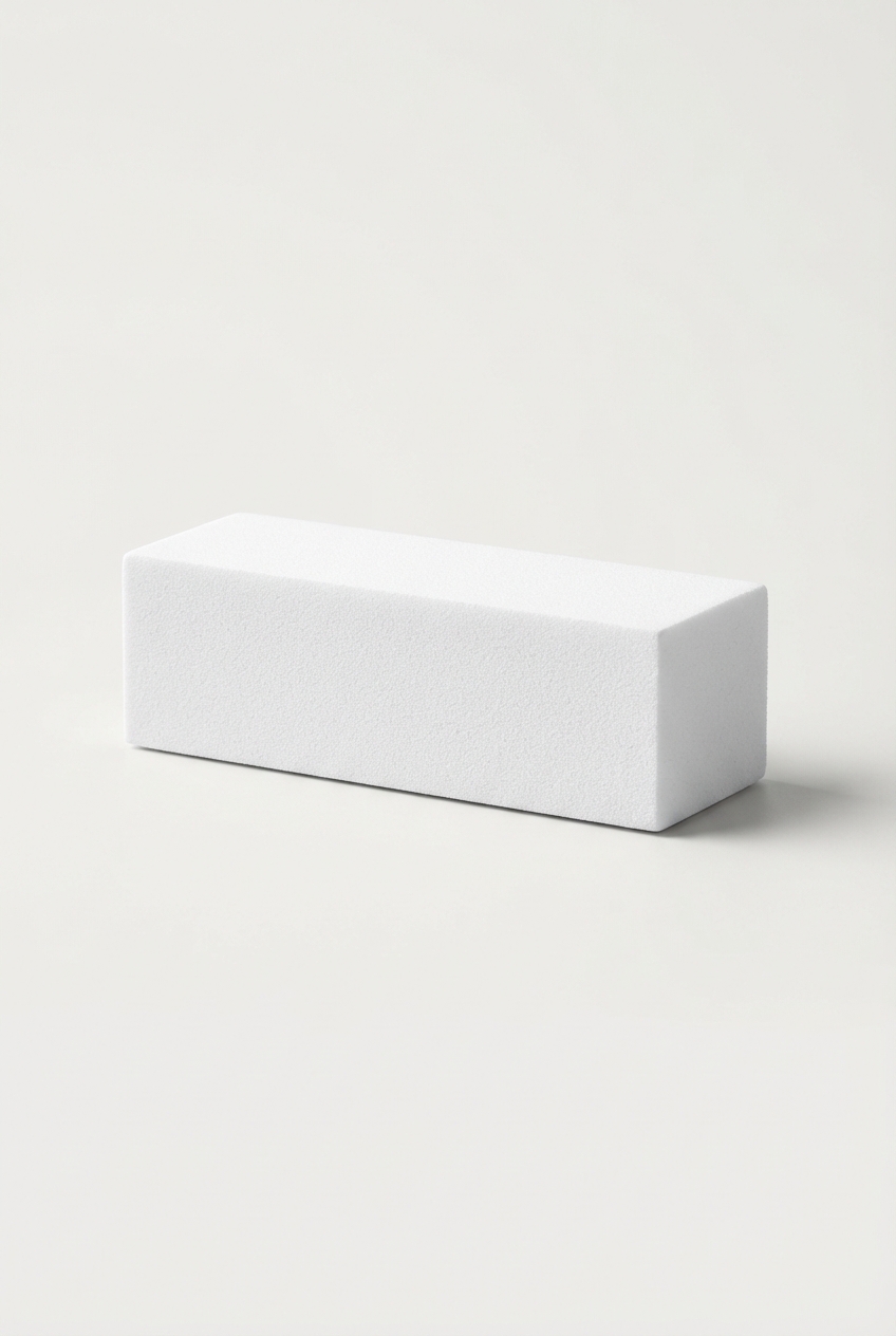 Minimalist nail buffer block on off-white background
