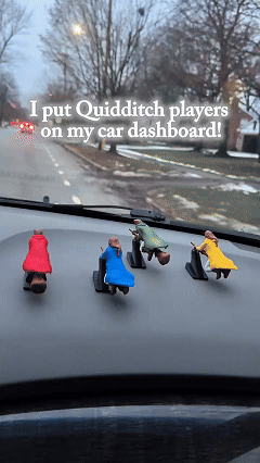 Spinning broomstick wizard car ornament motion gif
