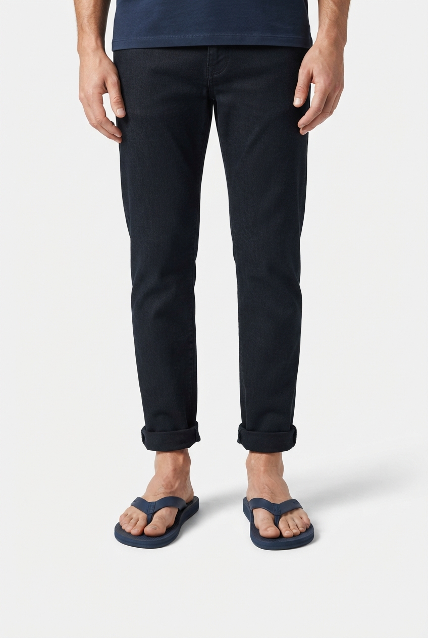 Dark blue men's flip flops in a minimalist scene