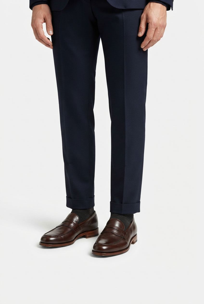 Brown men's penny loafers styled for smart casual outfits