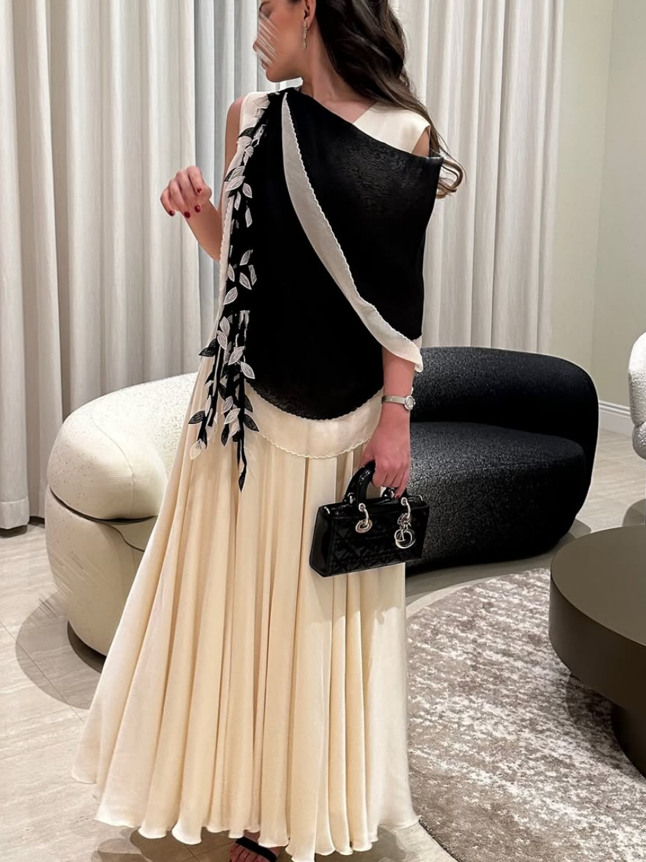Elegant evening dress with a layered design and decorative details