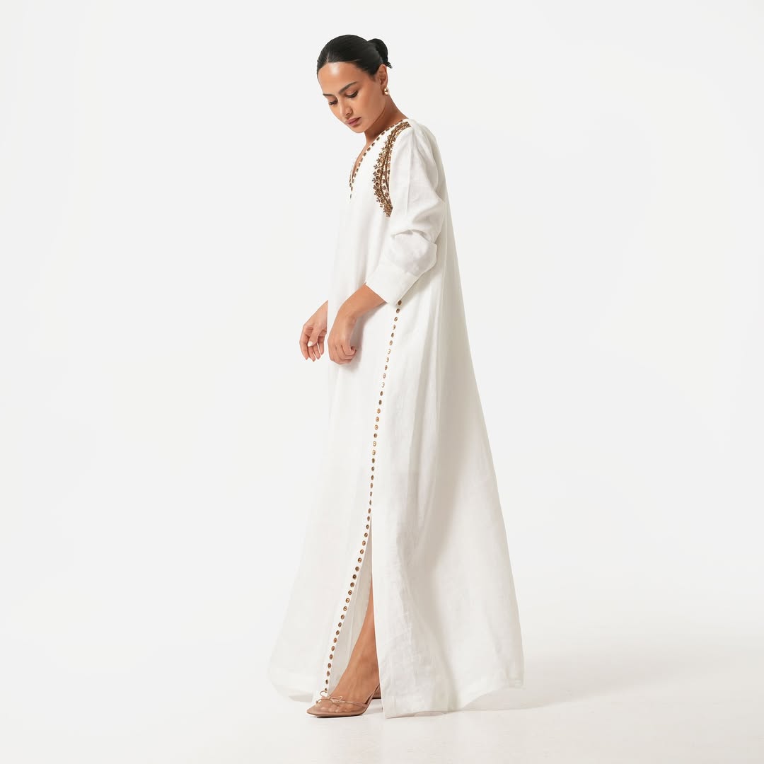 White maxi dress with gold bead embroidery
