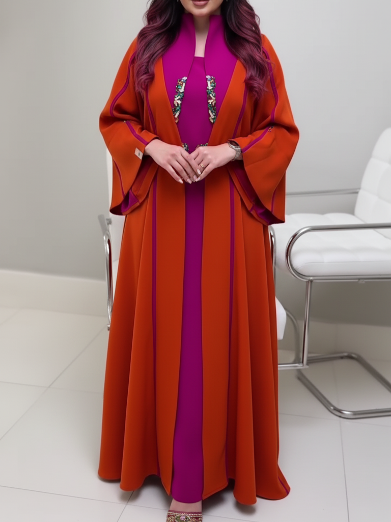 A luxurious abaya set in fuchsia and orange with elegant embroidery.