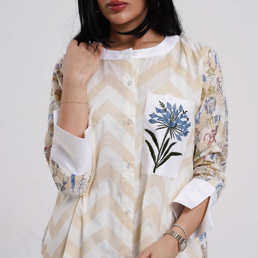 Elegant long dress with a chevron design and floral embroidery
