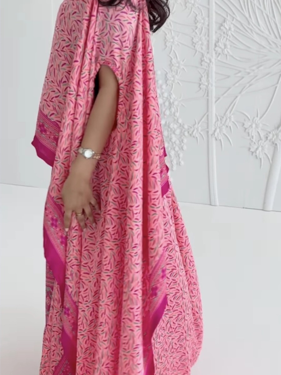 Elegant pink kaftan dress with a printed design