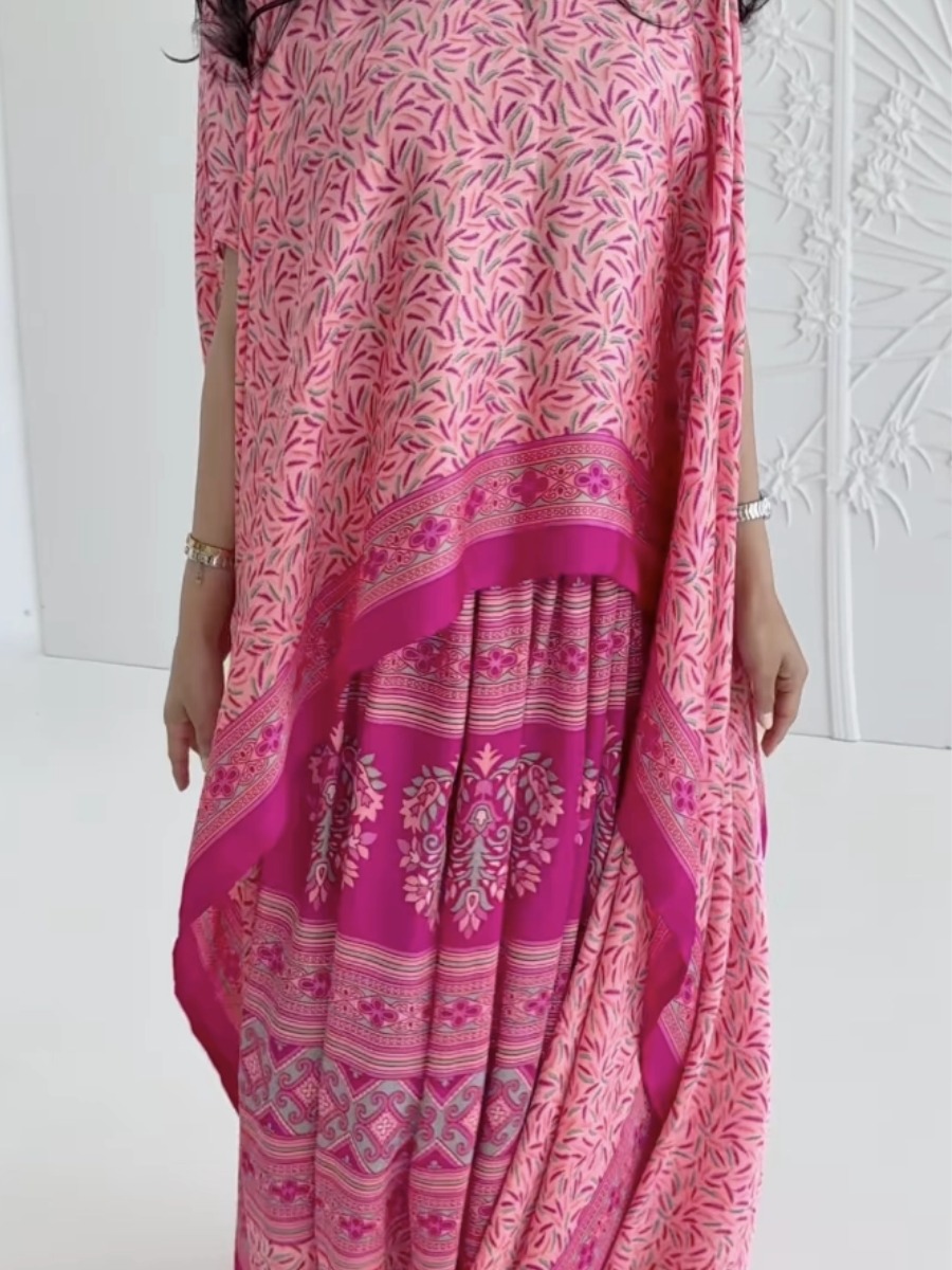 Elegant pink kaftan dress with a printed design