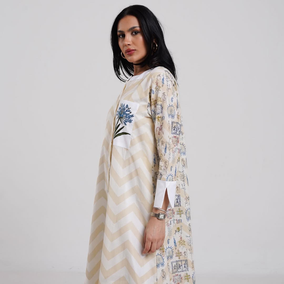 Elegant long dress with a chevron design and floral embroidery