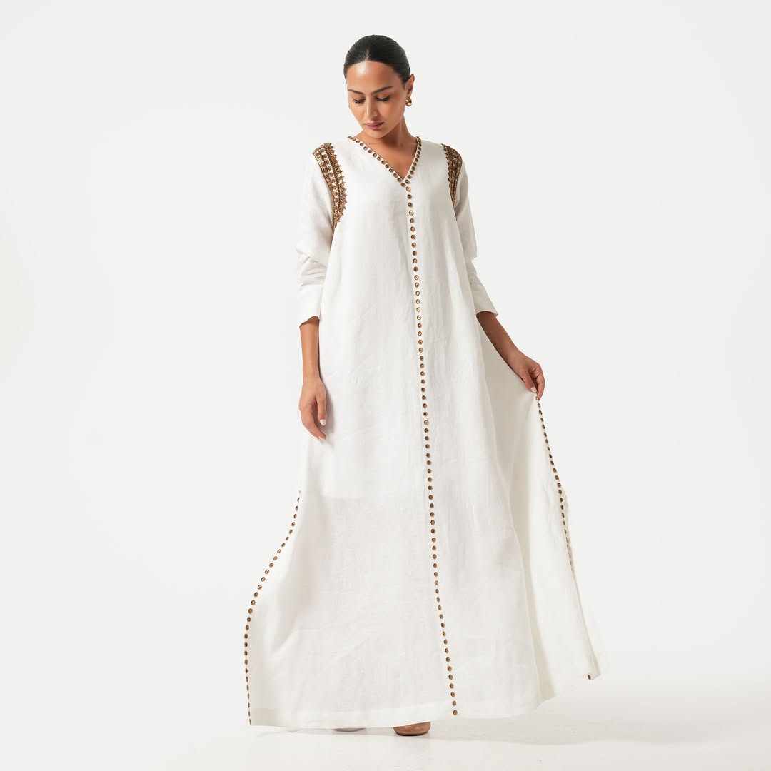 White maxi dress with gold bead embroidery