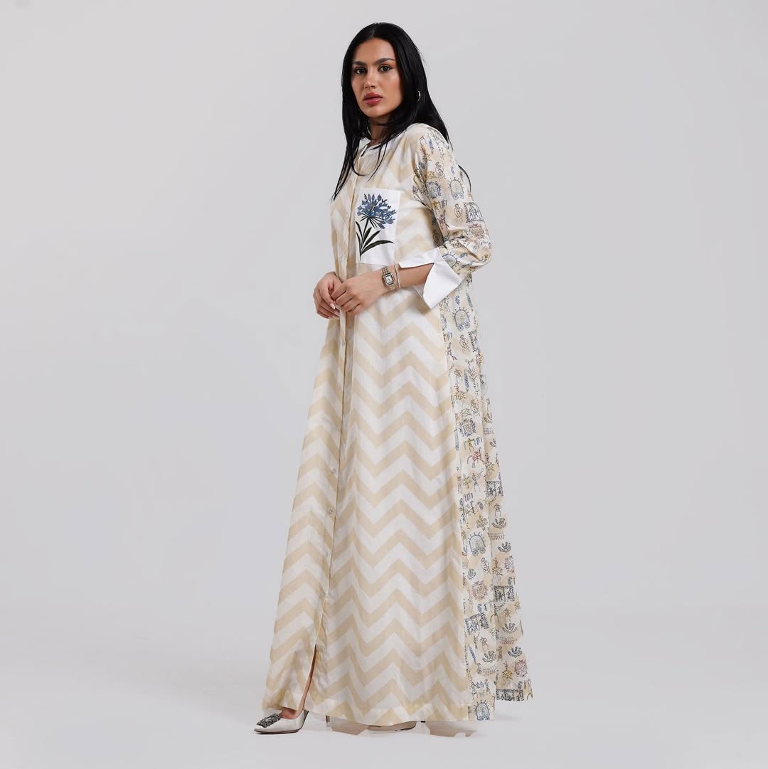 Elegant long dress with a chevron design and floral embroidery