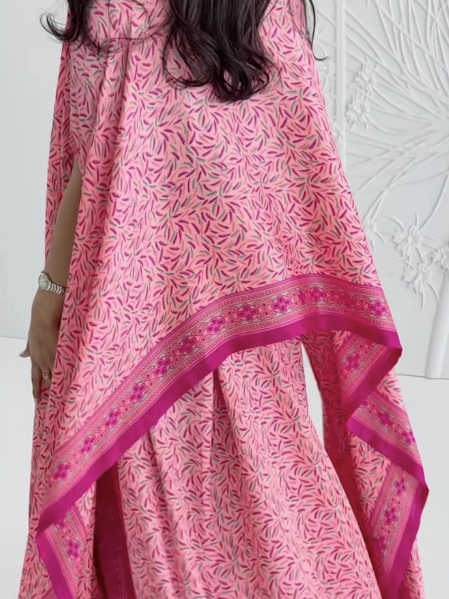 Elegant pink kaftan dress with a printed design