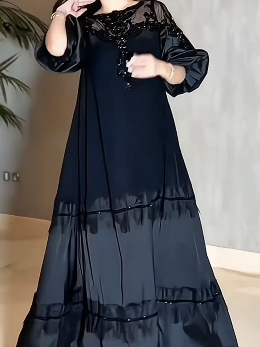 Luxurious black evening dress with elegant embroidery and satin sleeves
