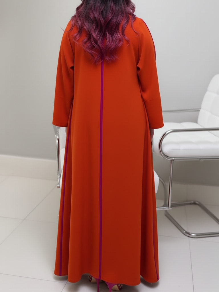 A luxurious abaya set in fuchsia and orange with elegant embroidery.