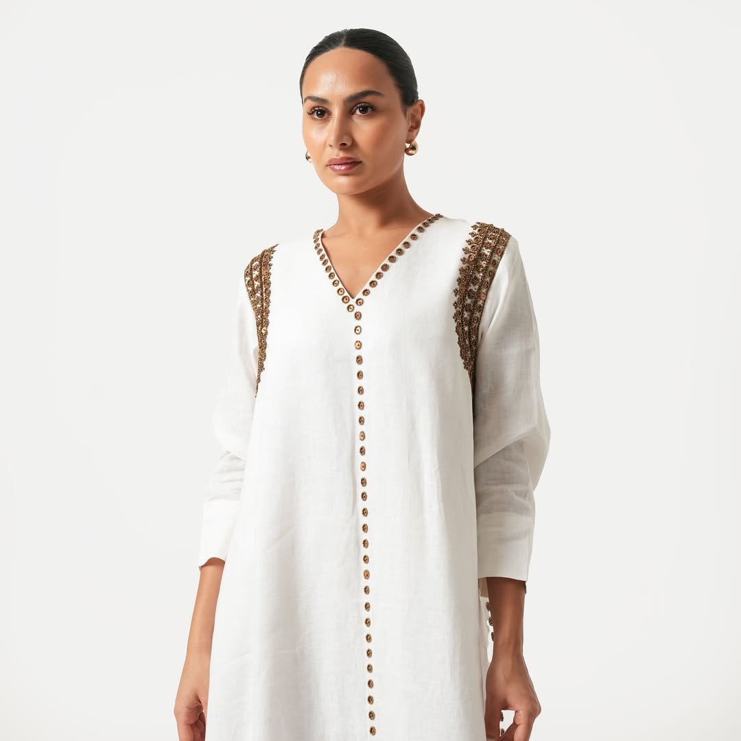 White maxi dress with gold bead embroidery