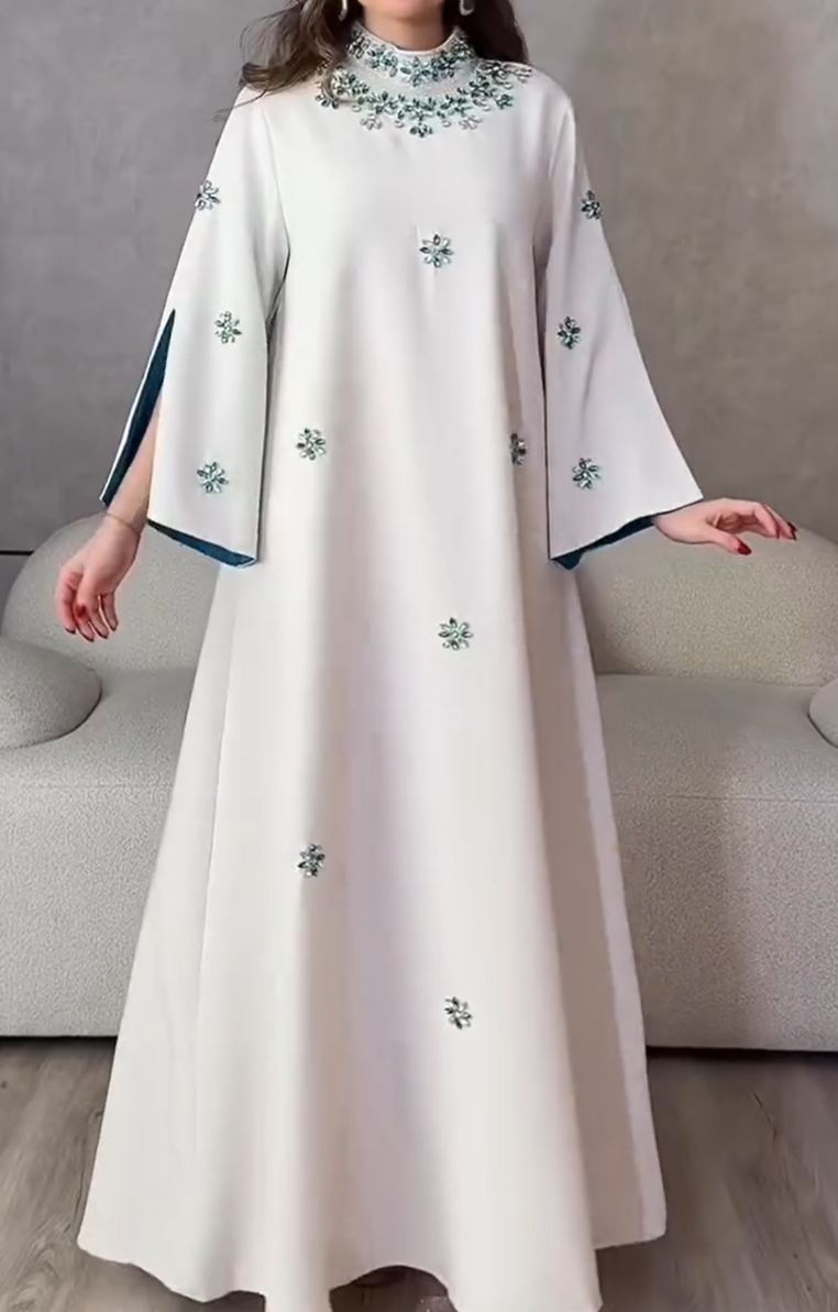 Luxurious evening dress with turquoise crystal embroidery