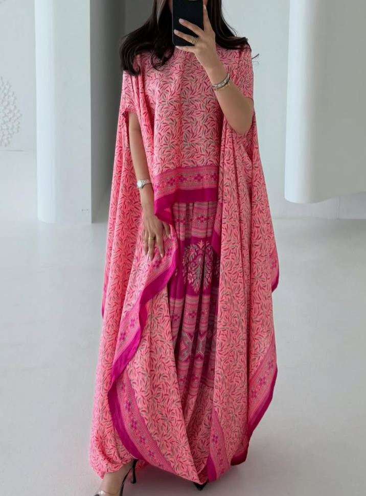 Elegant pink kaftan dress with a printed design
