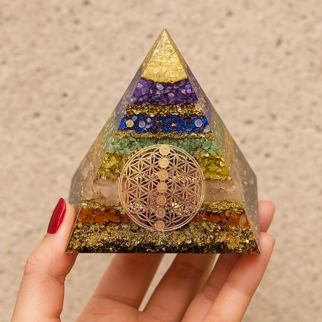 Close-up of the layered colors and golden sparkles on the orgonite pyramid - KARMAKIND