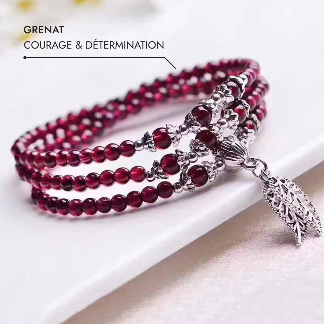 Garnet bracelet worn on a wrist, showing its rich color