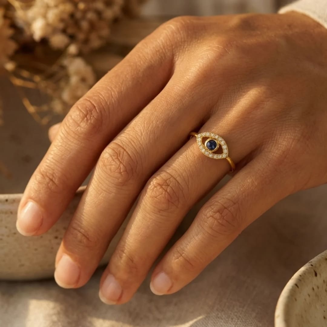 Adjustable Blue Eye Ring worn on a finger - KARMAKIND