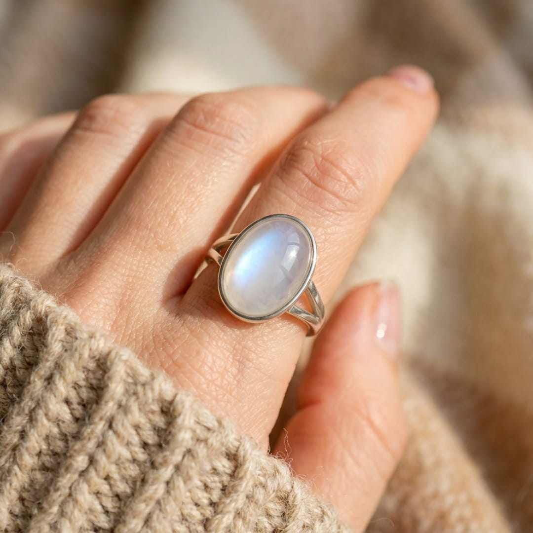 Close-up of the adjustable Moonstone Ring showing the milky stone and its blue iridescence - KARMAKI