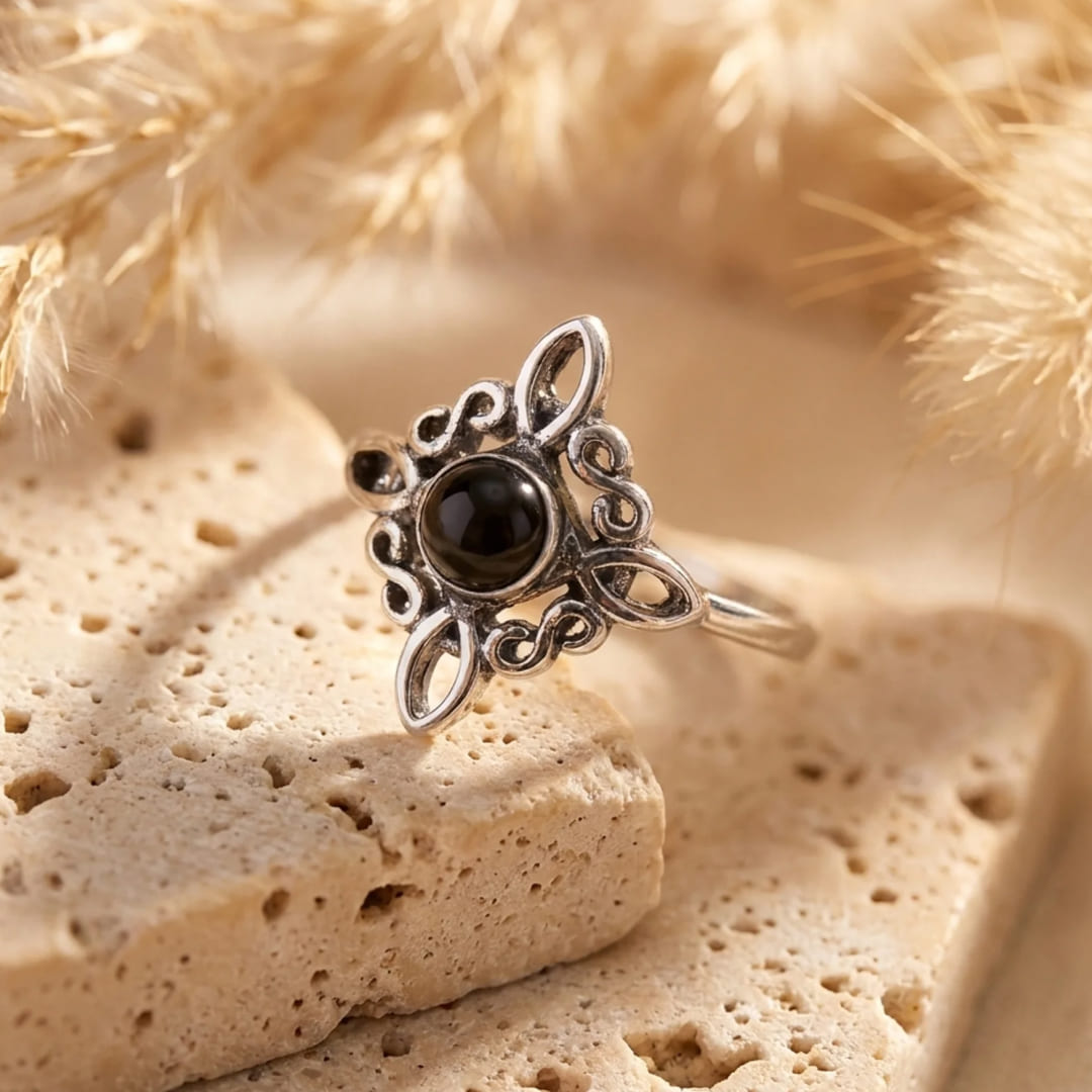 Ring on a finger showing the adjustable band - KARMAKIND