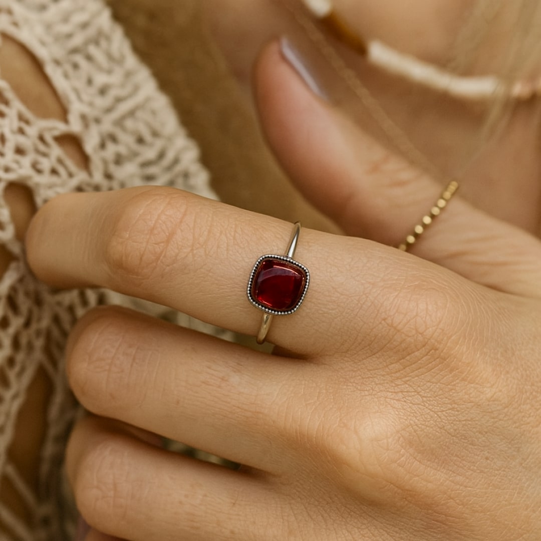 Close-up of the deep red garnet stone - KARMAKIND
