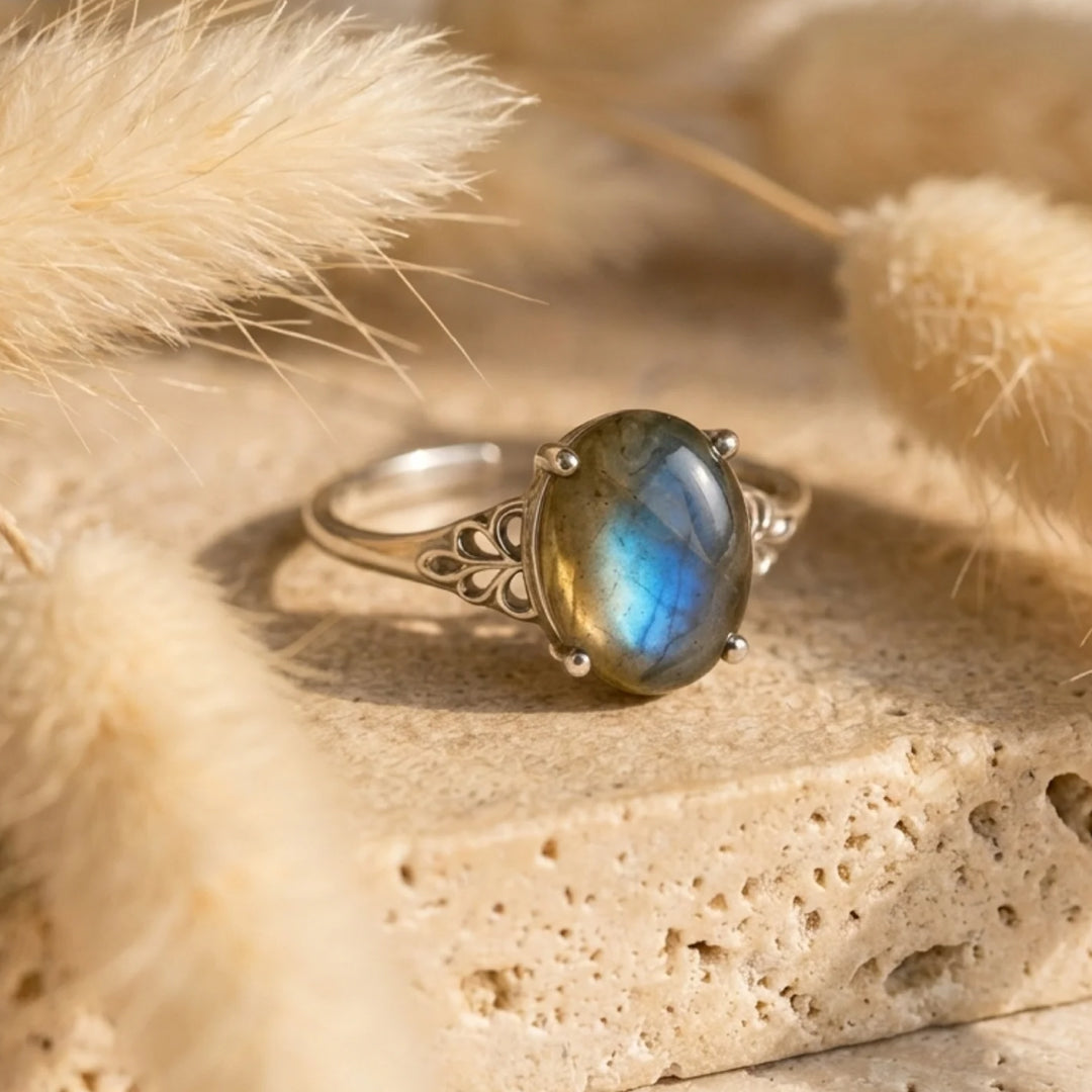 Side view of the Amara ring with detailed silver volutes